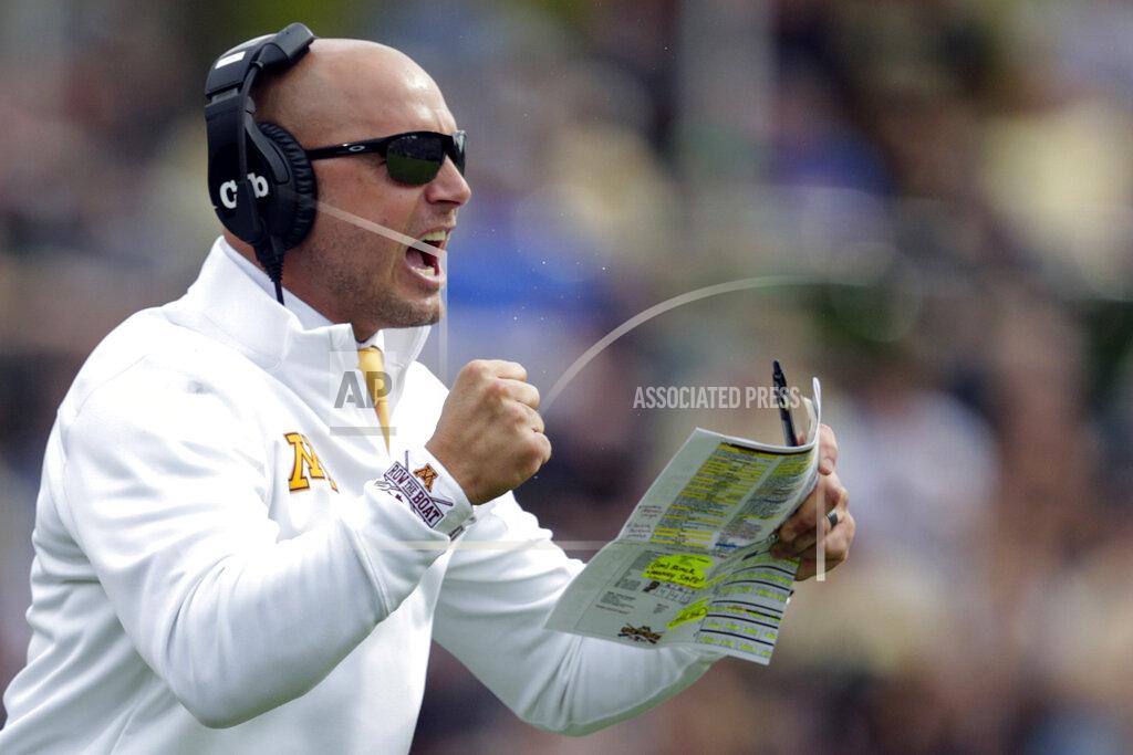 Michael Conroy FILE - In this Sept. 28, 2019, file photo, Minnesota head coach P.J. Fleck celebrates a touchdown during the first half of an NCAA college football game against Purdue in West Lafayette, Ind. The coronavirus is preventing prospects from leaving home to visit campuses and is keeping college coaches from traveling to evaluate players across the country. (AP Photo/Michael Conroy, File)