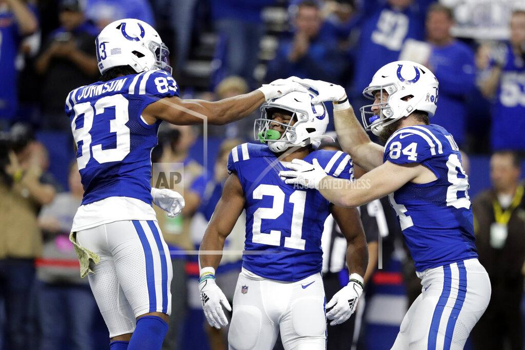 Michael Conroy Indianapolis Colts' Nyheim Hines (21) celebrates a rushing touchdown with Marcus Johnson (83) and Jack Doyle (84) during the second half of an NFL football game against the Jacksonville Jaguars, Sunday, Nov. 17, 2019, in Indianapolis. (AP Photo/Michael Conroy)