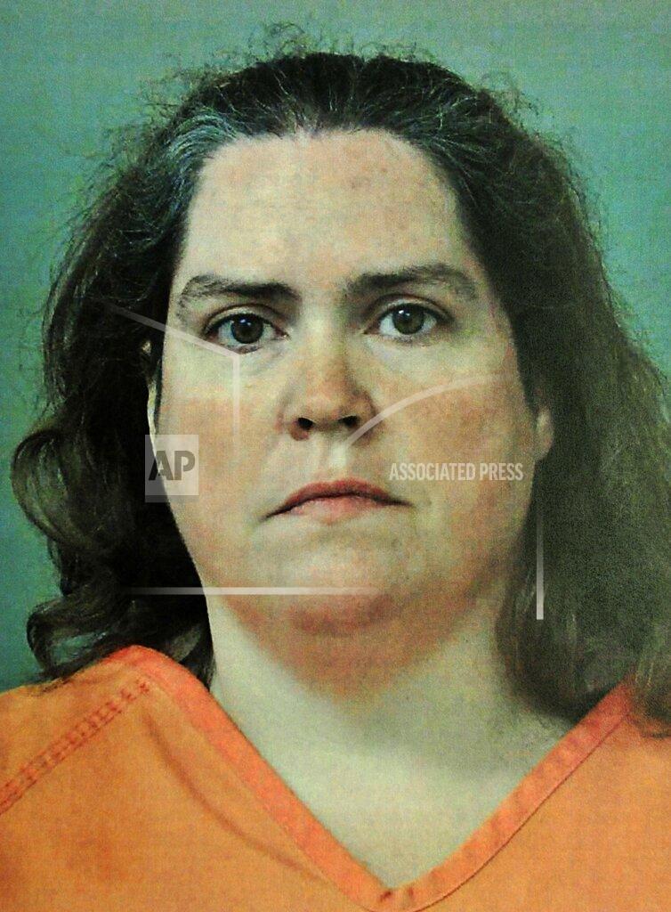 Uncredited This photo provided by the Madison County, Ala., Sheriff's Department shows Rhonda Jean Carlson, who received a life sentence Wednesday, Oct. 27, 2021, for helping her husband plan the 2015 killings of his estranged pregnant wife, her unborn child and three others. Carlson, 48, avoided the death penalty in a deal with prosecutors in exchange for testifying against her husband, Christopher Henderson, prior to his trial. She admitted to helping plan the attack and was sentenced to life in prison without the possibility of parole. (Madison County Sheriff's Department/AL.com, via AP, File)