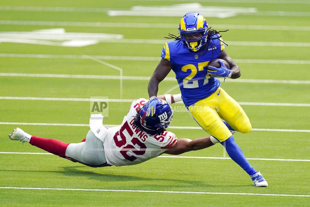 Ashley Landis Los Angeles Rams running back Darrell Henderson (27) runs past New York Giants linebacker Devante Downs during the first half of an NFL football game Sunday, Oct. 4, 2020, in Inglewood, Calif. (AP Photo/Ashley Landis)