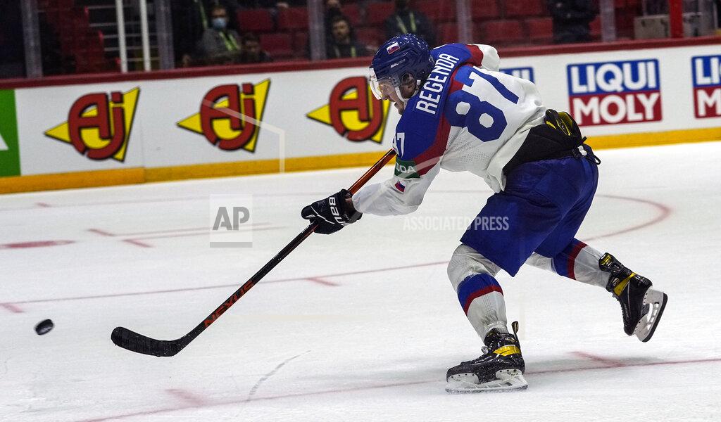Martin Meissner Slovakia's Pavol Regenda scores the final goal during the group A Hockey World Championship match between France and Slovakia in Helsinki, Finland, Friday May 13, 2022. (AP Photo/Martin Meissner)