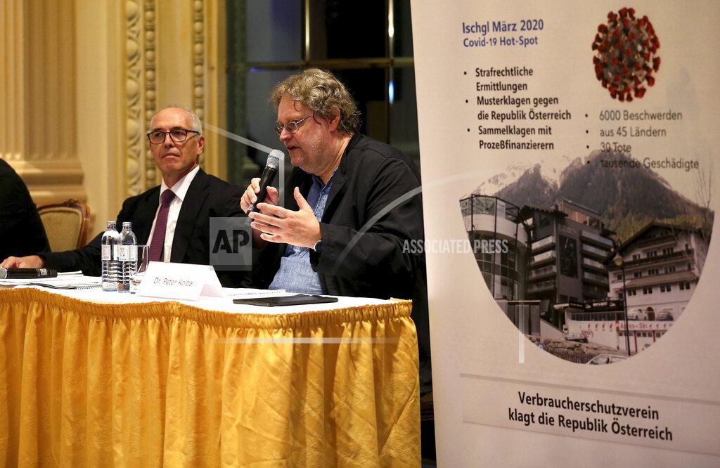 Ronald Zak Attorney Alexander Klauser and chairman of the consumer protection association Peter Kolba, from left, speake during a joint press conference of a class action lawsuit against the Tirol regional authorities for failing in their public health duties, related to the virus outbreak in the ski-resort of Ischgl, seen as a key location from which the virus spread across Europe, in Vienna, Austria, Wednesday, Sept. 23, 2020. (AP Photo/Ronald Zak)