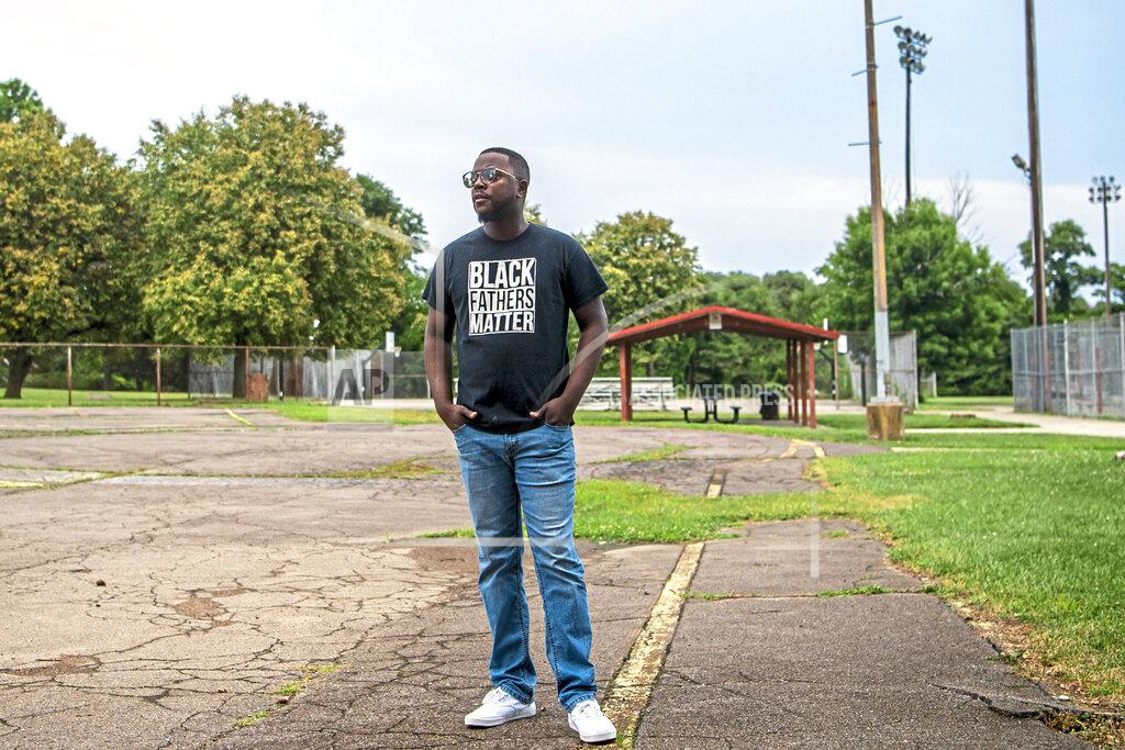 Alexandra Wimley Rev. Michael Day, of the Legacy International Worship Center, stands for a portrait in Northview Heights, Wednesday, Aug. 11, 2021. Day is making it his mission to work with the city and group violence outreach workers to address the needs of families in Northview Heights. He and church members planned to set up a tent in the neighborhood and try to connect residents to counseling, basic necessities and church ministries.(Alexandra Wimley/Pittsburgh Post-Gazette via AP)