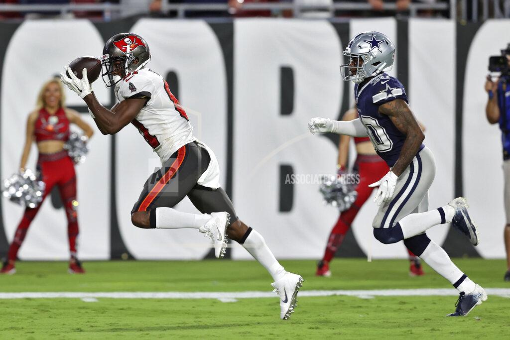 Mark Lomoglio Tampa Bay Buccaneers wide receiver Antonio Brown (81) pulls in a touchdown reception iafter getting around Dallas Cowboys cornerback Anthony Brown (30) during the first half of an NFL football game Thursday, Sept. 9, 2021, in Tampa, Fla. (AP Photo/Mark LoMoglio)