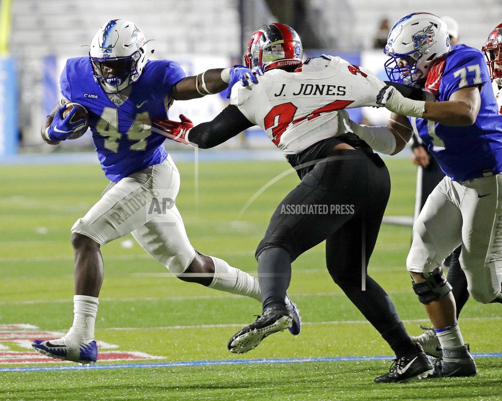 Mark Humphrey Middle Tennessee running back Chaton Mobley (44) gets past Western Kentucky defensive lineman Juwuan Jones (34) as Middle Tennessee offensive lineman Amir Luckett (77) blocks during the second half of an NCAA college football game Friday, Nov. 2, 2018, in Murfreesboro, Tenn. Middle Tennessee won 29-10. (AP Photo/Mark Humphrey)