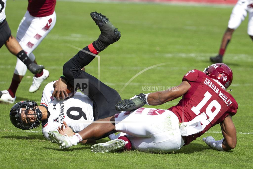 Chris Szagola Cincinnati's quarterback Desmond Ridder (9) gets sacked by Temple's linebacker Isaiah Graham-Mobley (19) during the first half of an NCAA college football, Saturday, Oct. 20, 2018, in Philadelphia. (AP Photo/Chris Szagola)