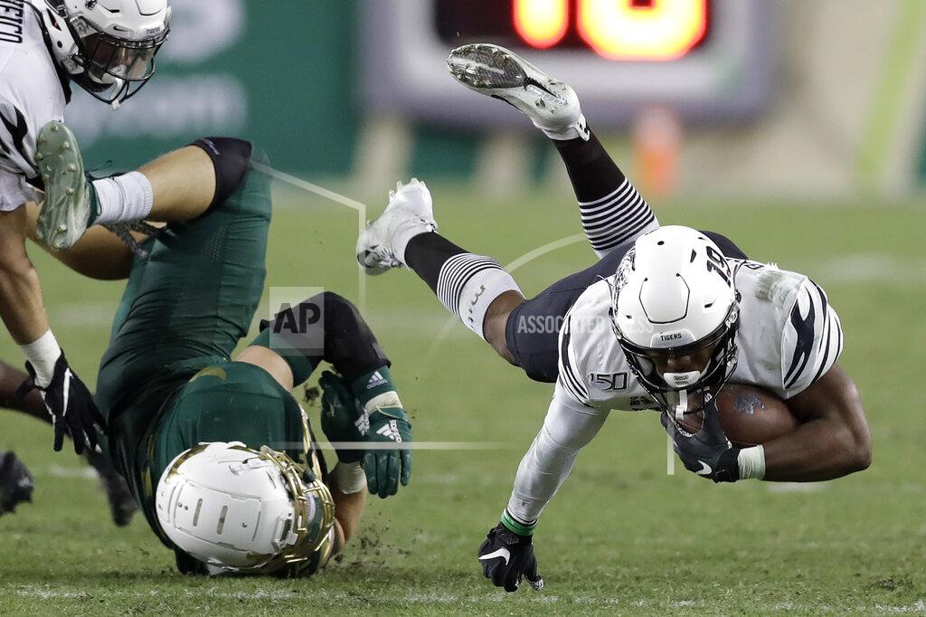 Chris O'meara Memphis running back Kenneth Gainwell (19) gets upended by South Florida linebacker Andrew Mims during the second half of an NCAA college football game Saturday, Nov. 23, 2019, in Tampa, Fla. (AP Photo/Chris O'Meara)