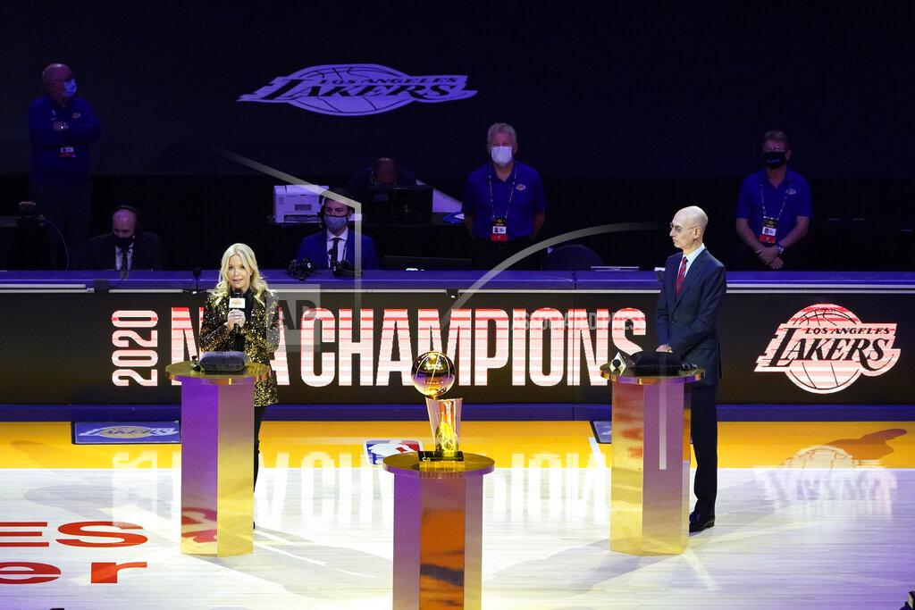 Marcio Jose Sanchez Los Angeles Lakers owner Jeanie Buss, left, speaks behind the championship trophy, near NBA Commissioner Adam Silver before the team's basketball game against the Los Angeles Clippers on Tuesday, Dec. 22, 2020, in Los Angeles. (AP Photo/Marcio Jose Sanchez)