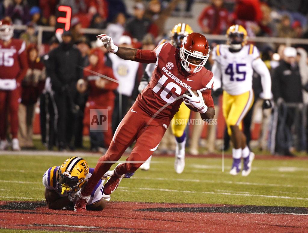 Michael Woods Arkansas receiver La'Michael Pettway is tripped up by LSU defender Terrence Alexander during the second half of an NCAA college football game, Saturday, Nov. 10, 2018, in Fayetteville, Ark. LSU won, 24-17. (AP Photo/Michael Woods)