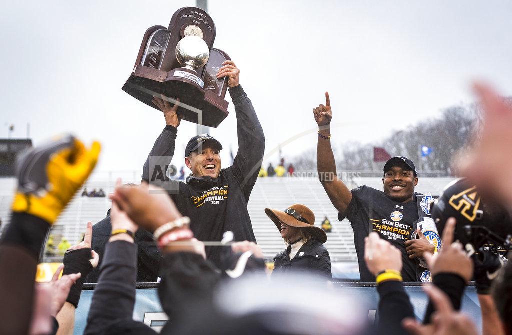 Andrew Dye/Journal Appalachian State head coach Scott Satterfield celebrates after the Mountaineers won the Sunbelt Championship on Saturday, Dec. 1, 2018 in Boone, N.C. (Andrew Dye/The Winston-Salem Journal via AP)