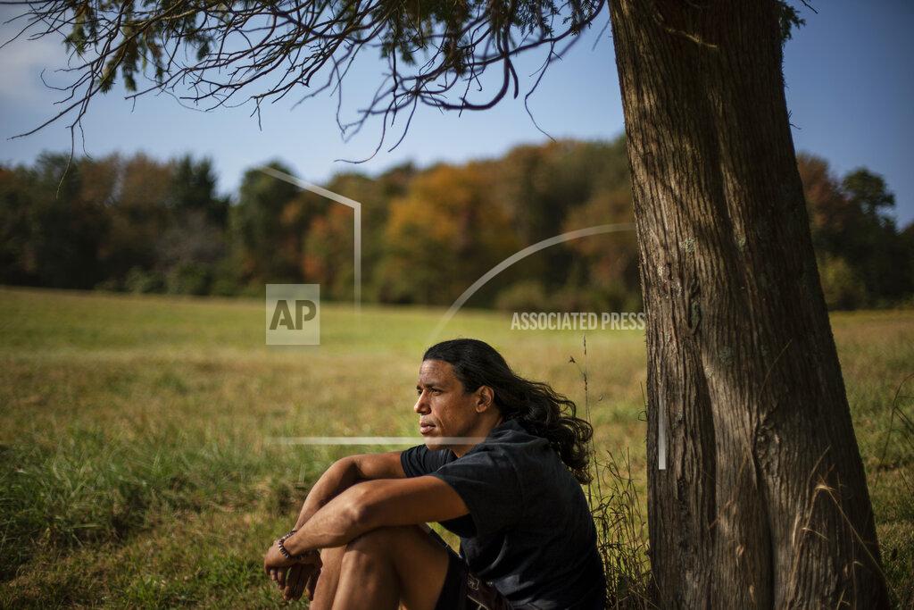 David Goldman Annawon Weeden, 46, a member of the Mashpee Wampanoag Tribe, sits for a portrait outside his home in Oakdale, Conn., Friday, Sept. 25, 2020. "How do you pay somebody for that?" said Weeden when asked if governments should make financial reparations to Native people. "The most valuable thing anyone can have or possess ever is time and you don't get that time back. I don't get my ancestors back. It's degrading to think that you could buy your way out of what you put us in. Actions speak for themselves," Weeden said. "You don't got to pay me a dime. Clean up your community, show some respect. Pay the land the respect. It's never about me. It's about this land. I'm only here for a short time. This land had to last a lot longer. Your children are going to have to inherit this. What do you want to leave them? Let's look about our children and how our children's lives are going to turn out because if we can't get things to go better for them, we've all failed." (AP Photo/David Goldman)