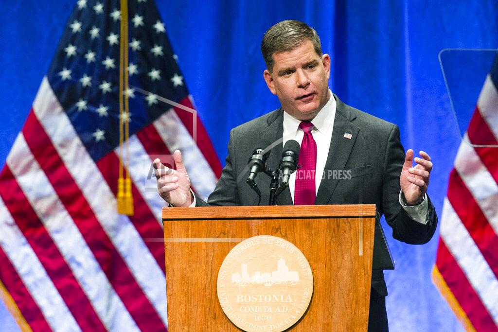 Keith Bedford FILE - In this Jan. 1, 2018 file photo, Boston Mayor Marty Walsh speaks during his second inauguration in Boston. Walsh said public schools will switch to all-remote learning starting Thursday, Oct. 22, 2020, because of increasing coronavirus cases. The city’s seven-day average positive test rate is currently 5.7%, up from last week’s rate of 4.5%. (Keith Bedford/The Boston Globe via AP, File)