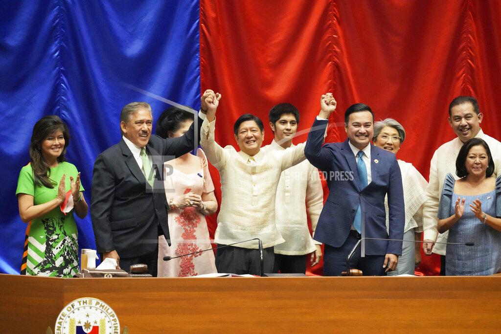 Aaron Favila Philippines President-elect Ferdinand "Bongbong" Marcos Jr., center, raises hands with Senate President Miguel Zubiri, left, and House speaker Lord Allan Velasco after his proclamation by the National Board of Canvassers on Wednesday May 25, 2022 at the House of Representatives, Quezon City, Philippines. (AP Photo/Aaron Favila)