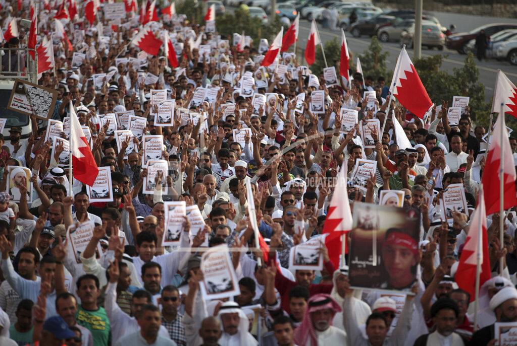 Hasan Jamali File - In this Friday, April 18, 2014 file photo, thousands of Bahraini anti-government protesters, waving national flags, signs and pictures of jailed political figures and people killed in unrest, chant slogans during a march organized by opposition groups in A'ali, Bahrain. A decade ago, against all odds, a popular uprising convulsed the monarchy of Bahrain as a wave of revolutionary protests swept across the Middle East. But after a brutal crackdown and years of escalating repression, activists say the small kingdom is less free now than even before the Arab Spring, as authorities crush hopes for political reform. (AP Photo/Hasan Jamali, File)