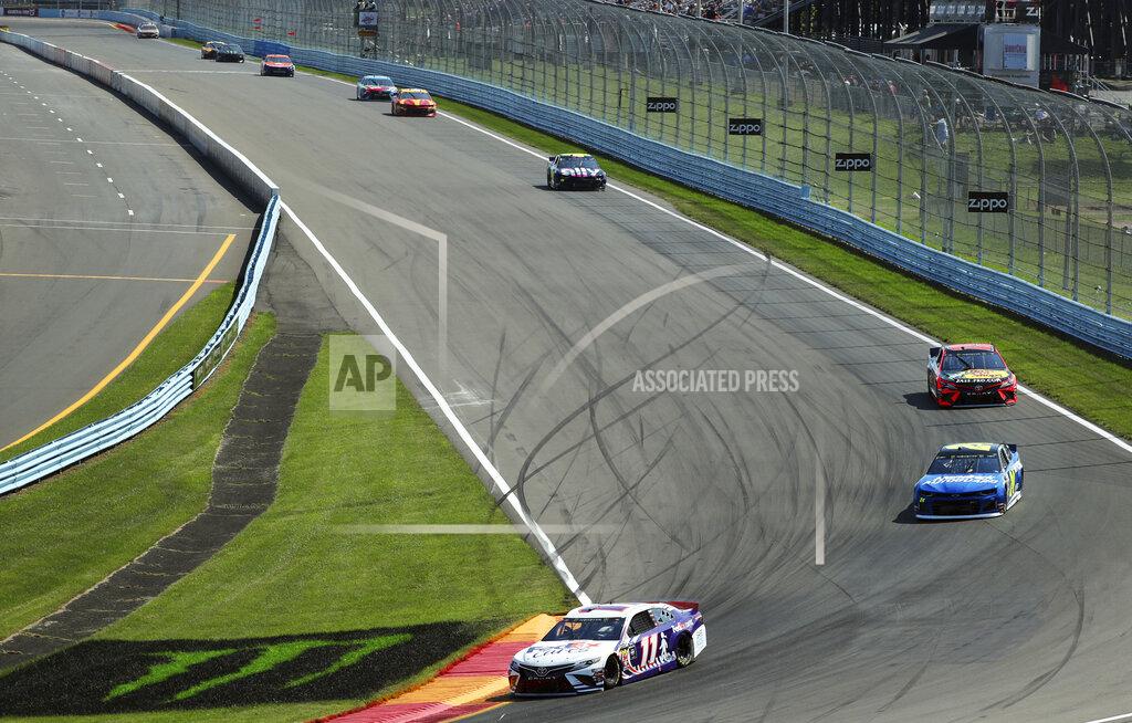 John Munson Denny Hamlin heads into Turn 1 during a NASCAR Cup Series auto race at Watkins Glen International, Sunday, Aug. 4, 2019, in Watkins Glen, N.Y. (AP Photo/John Munson)