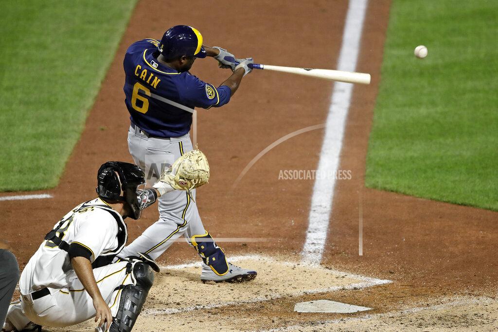 Milwaukee Brewers' Lorenzo Cain drives in a run with a single off Pittsburgh Pirates relief pitcher Nik Turley during the seventh inning of a baseball game in Pittsburgh, Monday, July 27, 2020. (AP Photo/Gene J. Puskar)