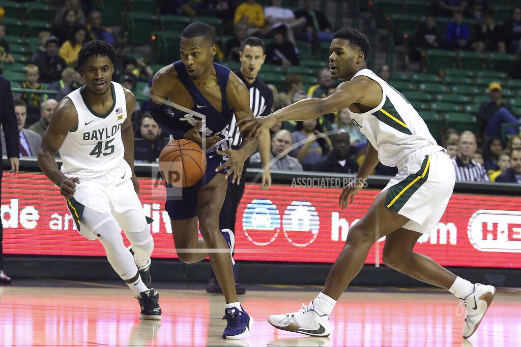 Jerry Larson Jackson State guard Jonas James (3) drives against Baylor guard Jared Butler (12) and Davion Mitchell (45) in the first half of an NCAA college basketball game, Monday, Dec. 30, 2019, in Waco, Texas. (AP Photo/Jerry Larson)