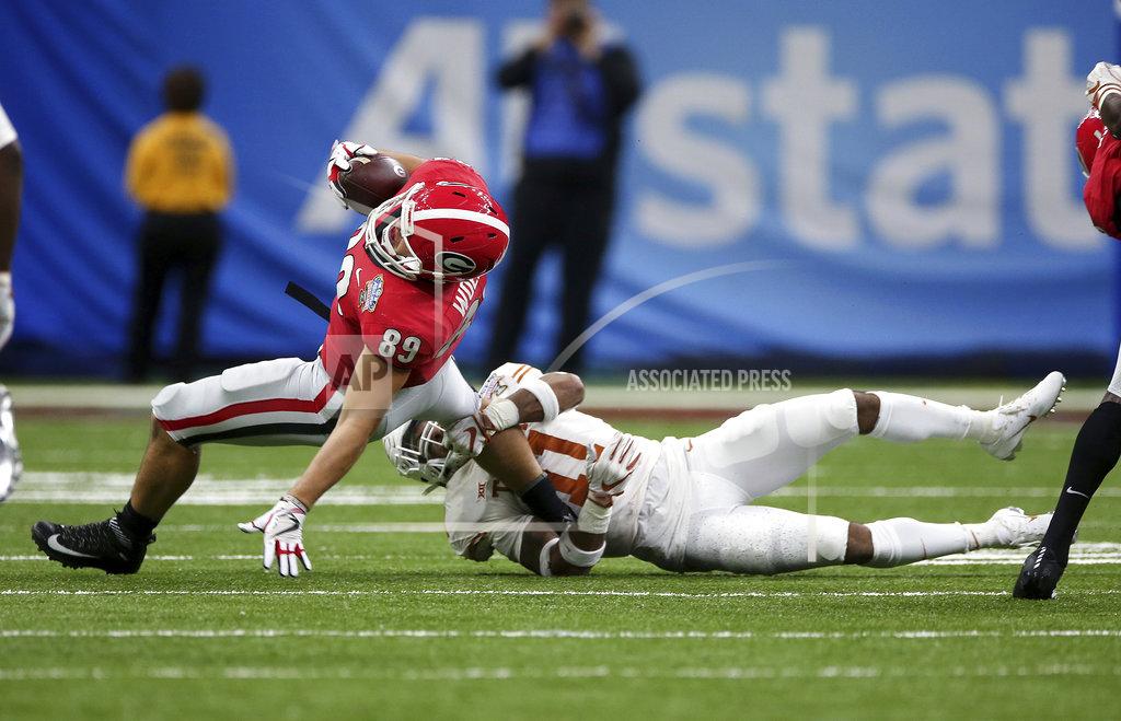 Rusty Costanza Georgia tight end Charlie Woerner (89) is tackled by Texas defensive back P.J. Locke III (11) during the first half of the Sugar Bowl NCAA college football game in New Orleans, Tuesday, Jan. 1, 2019. (AP Photo/Rusty Costanza)