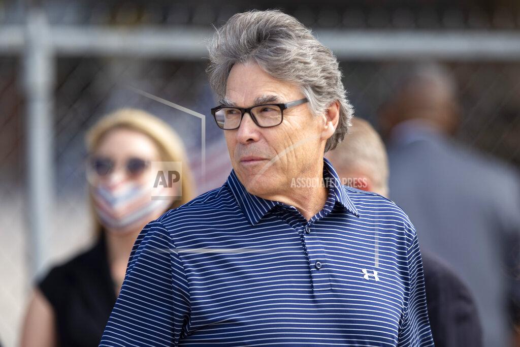 Ben Powell Former Energy Secretary Rick Perry waits with other guests before being let onto the tarmac to welcome President Donald Trump to Midland, Texas Wednesday afternoon July 29, 2020. (Ben Powell/Odessa American via AP)