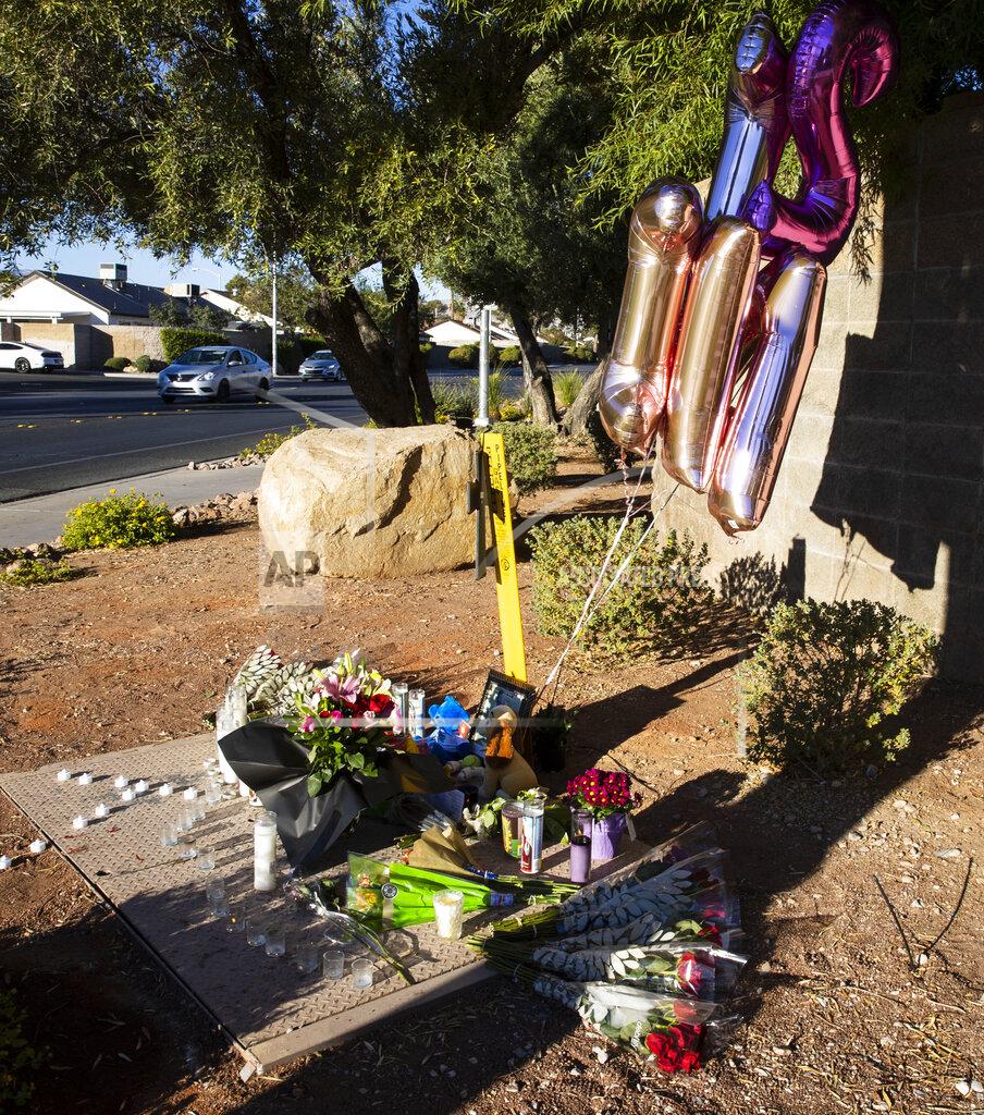 Bizuayehu Tesfaye A makeshift memorial to honor Tina Tintor, 23, is seen at South Rainbow Boulevard and Spring Valley Parkway, on Thursday, Nov. 4, 2021, in Las Vegas. Tintor and her dog were killed when former Raiders wide receiver Henry Ruggs, accused of DUI, slammed into the rear of Tintor's vehicle. (Bizuayehu Tesfaye/Las Vegas Review-Journal)
