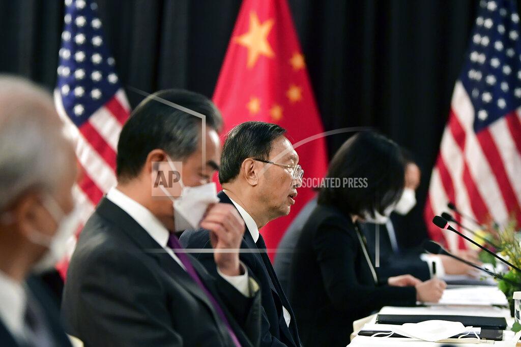 Frederic J. Brown Chinese Communist Party foreign affairs chief Yang Jiechi, center, and China's State Councilor Wang Yi, second from left, speak at the opening session of US-China talks at the Captain Cook Hotel in Anchorage, Alaska, Thursday, March 18, 2021. (Frederic J. Brown/Pool via AP)