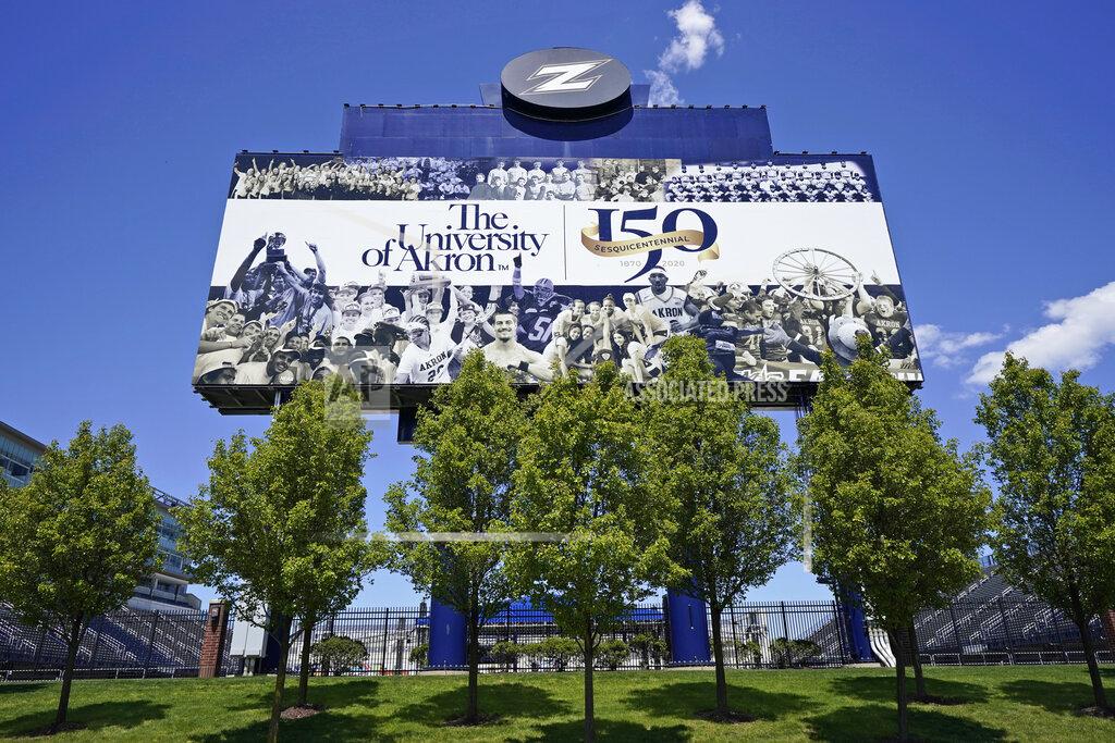 A billboard at the University of Akron is displayed, Thursday, May 13, 2021, in Akron, Ohio. Ohio Gov. Mike DeWine recently announced a weekly $1 million prize and full-ride college scholarships to entice more Ohioans to get the COVID-19 vaccine. (AP Photo/Tony Dejak)