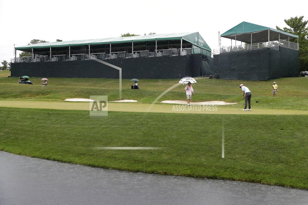 Darron Cummings Mackenzie Hughes, of Canada, putts on the 14th green during the final round of the Memorial golf tournament, Sunday, July 19, 2020, in Dublin, Ohio. (AP Photo/Darron Cummings)