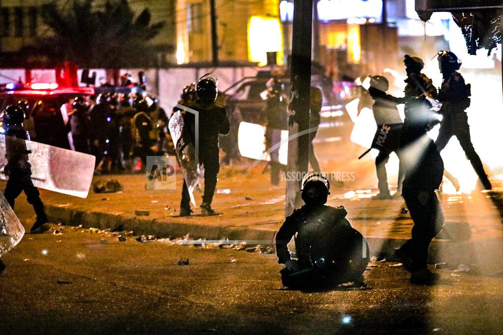 Security forces prevent anti-government protesters from setting up sit in tents in Basra, Iraq, Friday, Nov. 6, 2020. (AP Photo/Nabil al-Jurani}