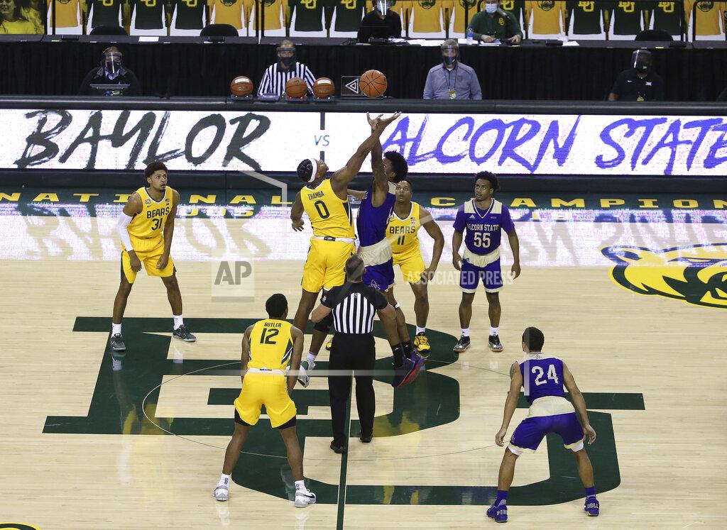 Jerry Larson Baylor forward Flo Thamba (0) and Alcorn State forward Anthony Fairley (4) tip off in the in the first half of an NCAA college basketball game, Wednesday, Dec. 30, 2020, in Waco, Texas. (AP Photo/ Jerry Larson)