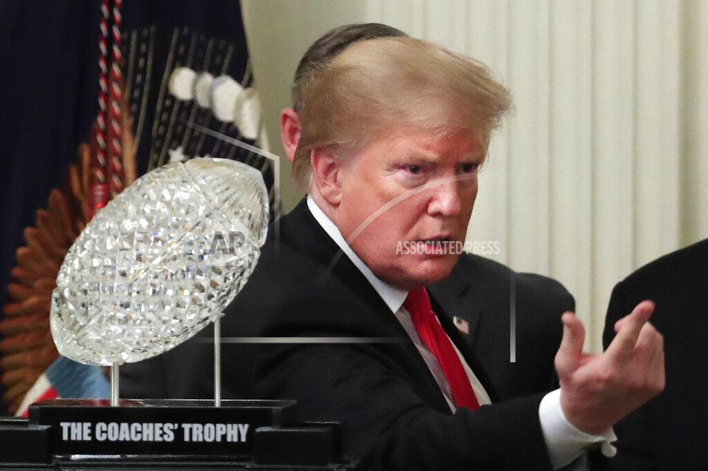 Manuel Balce Ceneta President Donald Trump calls an invited guest to join them on the stage during a ceremony welcoming the 2018 college football playoff National Champion Clemson Tigers to the White House in Washington, Monday, Jan. 14, 2019. (AP Photo/Manuel Balce Ceneta)
