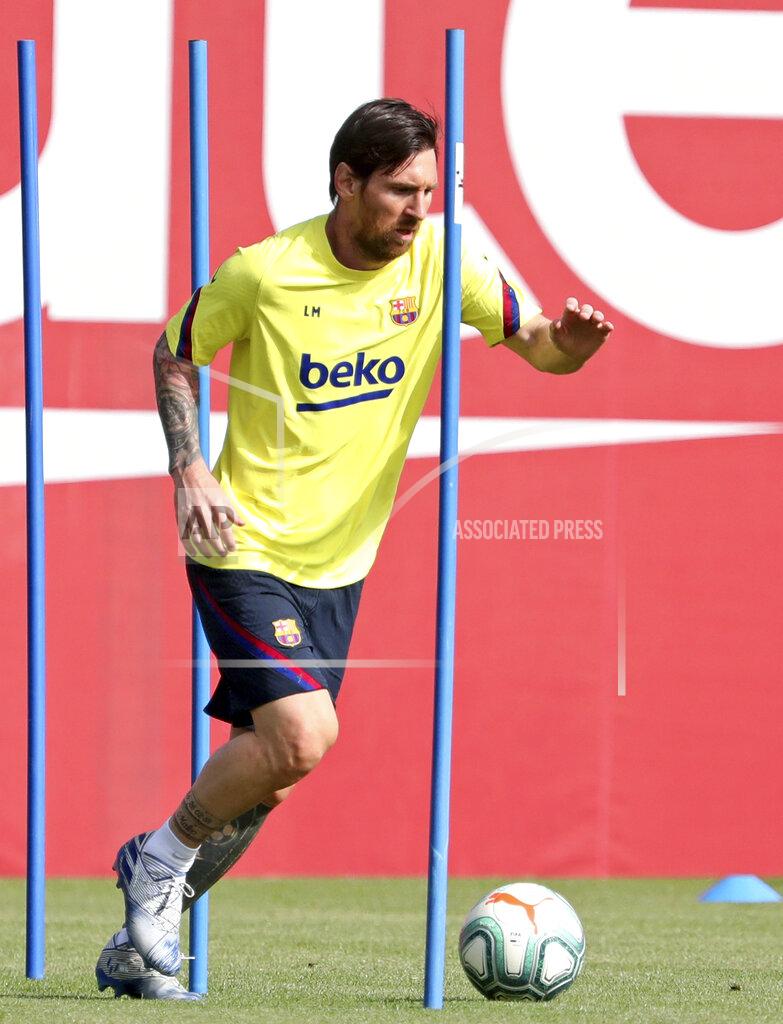 In this photo provided by FC Barcelona, Barcelona's Lionel Messi trains in Barcelona, Spain, on Friday May 8, 2020. Soccer players in Spain returned to train for the first time since the country entered a lockdown nearly two months ago because of the coronavirus pandemic. (Miguel Ruiz/FC Barcelona via AP)