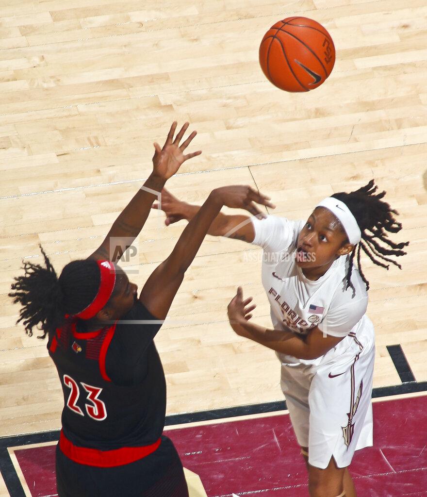 Phil Sears Louisville guard Jazmine Jones (23) shoots over Florida State guard Nicole Ekhomu (12) during the first half of an NCAA college basketball game in Tallahassee, Fla., Thursday, Jan. 24, 2019. (AP Photo/Phil Sears)