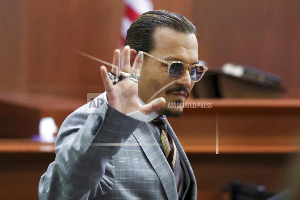 Michael Reynolds Actor Johnny Depp reacts as he leaves for a break in the courtroom in the Fairfax County Circuit Courthouse in Fairfax, Va., Thursday, May 26, 2022. Depp sued his ex-wife Amber Heard for libel in Fairfax County Circuit Court after she wrote an op-ed piece in The Washington Post in 2018 referring to herself as a "public figure representing domestic abuse." (Michael Reynolds/Pool Photo via AP)