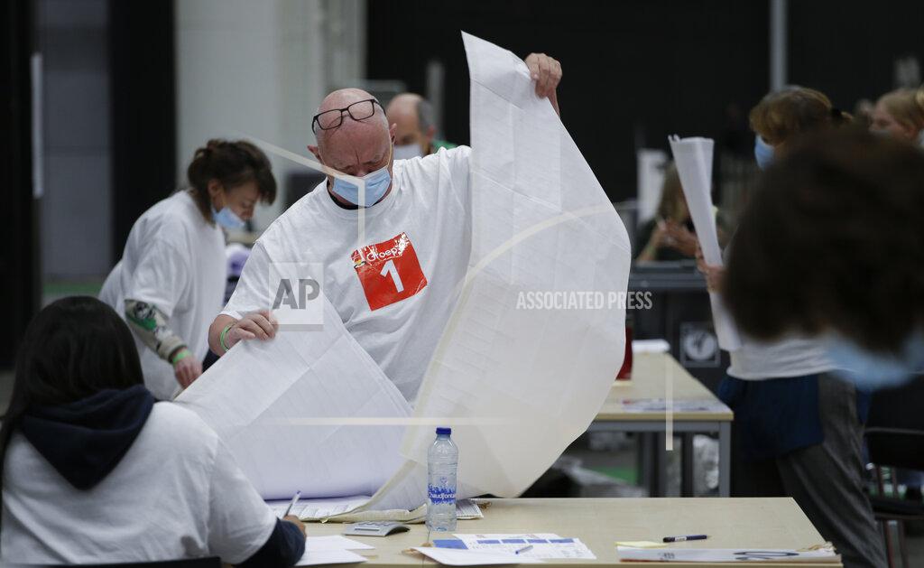 Peter Dejong Votes are being counted in general election in Amsterdam, Netherlands, Wednesday, March 17, 2021. The election was spread over three days to allow people to vote safely during the coronavirus pandemic, an exit poll published immediately after voting ended in the Dutch general election suggested that the conservative party of caretaker Prime Minister Mark Rutte has won the most seats, putting him first in line to form a new ruling coalition. (AP Photo/Peter Dejong)