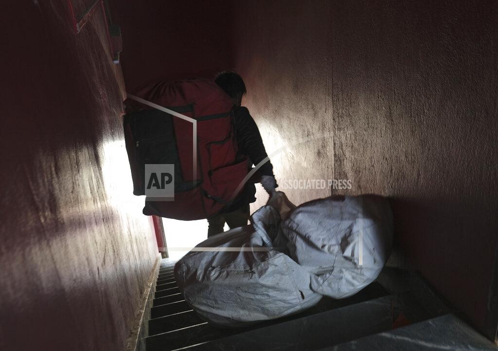 Yirmiyan Arthur An Amazon delivery person drags a bag containing packages as he steps out from his office to make deliveries, in Kohima, capital of the northeastern Indian state of Nagaland, Friday, May 29, 2020. India’s economic growth will fall to 4.2% in financial year 2019-20 as compared to 6.1% in the previous year and likely to contract this year because of the coronavirus pandemic. Millions of workers have fled cities after losing their jobs as authorities imposed the lockdown in March and started easing it early this month to promote economic activity. (AP Photo/Yirmiyan Arthur)