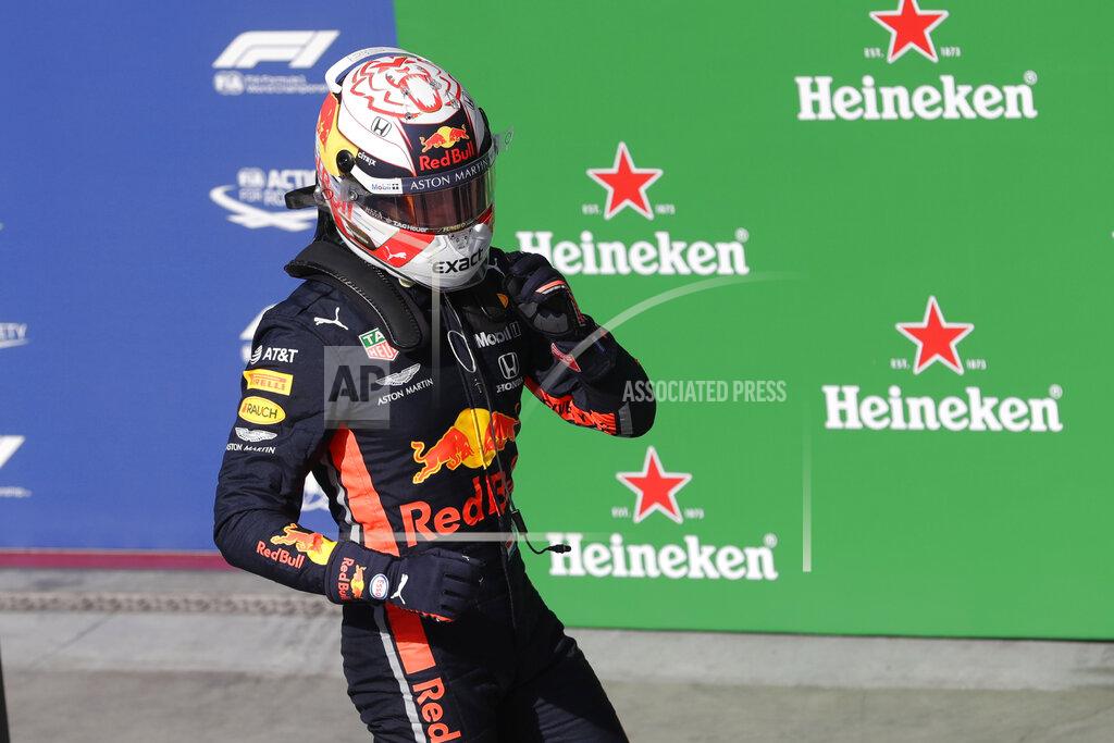 Silvia Izquierdo Red Bull driver Max Verstappen, of the Netherlands, celebrates after taking pole position during the qualifying session for the Formula One Brazil Grand Prix at the Interlagos race track in Sao Paulo, Brazil, Saturday, Nov. 16, 2019. (AP Photo/Silvia Izquierdo)