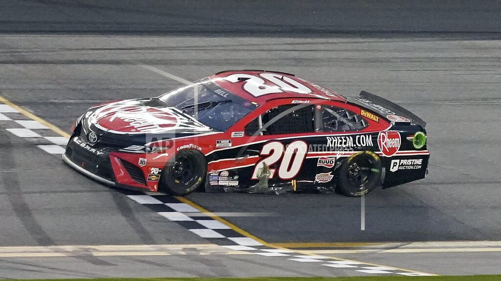 John Raoux Christopher Bell crosses the finish line to win the NASCAR Cup Series road course auto race at Daytona International Speedway, Sunday, Feb. 21, 2021, in Daytona Beach, Fla. (AP Photo/John Raoux)
