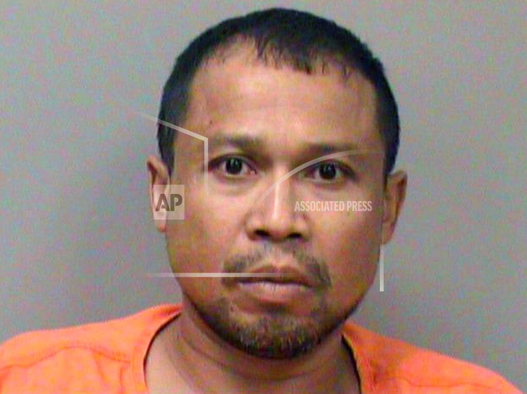 Uncredited This photo provided by the La Crosse County Sheriff's Office shows Khamthaneth Rattanasack. Three men who were found dead last week at the entrance of a Wisconsin quarry were forced to kneel on the ground before they were shot multiple times over a $600 debt, officials said Thursday, July 29, 2021. Khamthaneth Rattanasack, 44, and Nya Thao, 33, have each been charged with three counts of first-degree intentional homicide and one count of being a felon in possession of a firearm. (La Crosse County Sheriff's Office via AP)