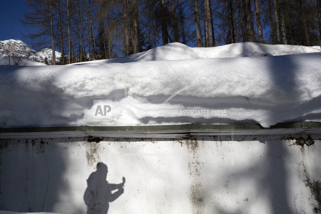 Gabriele Facciotti A view of the bobsled track in Cortina d'Ampezzo, Italy, Wednesday, Feb. 17, 2021. Bobsledding tradition in Cortina goes back nearly a century and locals are hoping that the Eugenio Monti track can be reopened for the 2026 Olympics in the Italian resort. (AP Photo/Gabriele Facciotti)