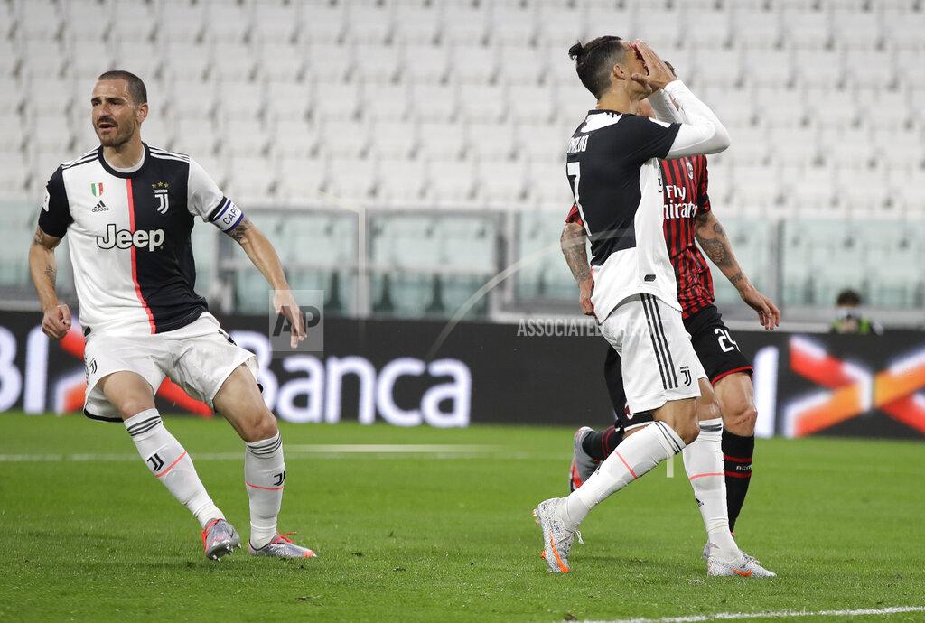 Luca Bruno Juventus' Cristiano Ronaldo reacts after missing a penalty during an Italian Cup second leg soccer match between Juventus and AC Milan at the Allianz stadium, in Turin, Italy, Friday, June 12, 2020. The match was being played without spectators because of the coronavirus lockdown. (AP Photo/Luca Bruno)