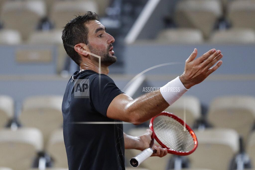 Alessandra Tarantino Croatia's Marin Cilic gestures in the first round match of the French Open tennis tournament against Austria's Dominic Thiem at the Roland Garros stadium in Paris, France, Monday, Sept. 28, 2020. (AP Photo/Alessandra Tarantino)