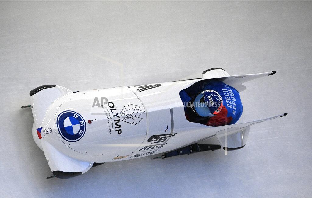 Dominik Dvorak and Jakub Nosek of Czech Republic speed down the track during their first run of the two man Bobsled World Cup race in Sigulda, Latvia, Saturday, Nov. 28, 2020. (AP Photo/Roman Koksarov)