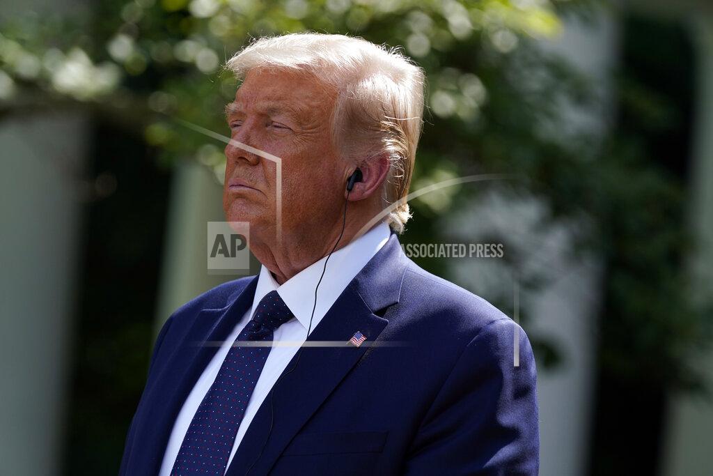 Evan Vucci President Donald Trump listens as Mexican President Andres Manuel Lopez Obrador speaks during an event in the Rose Garden at the White House, Wednesday, July 8, 2020, in Washington. (AP Photo/Evan Vucci)