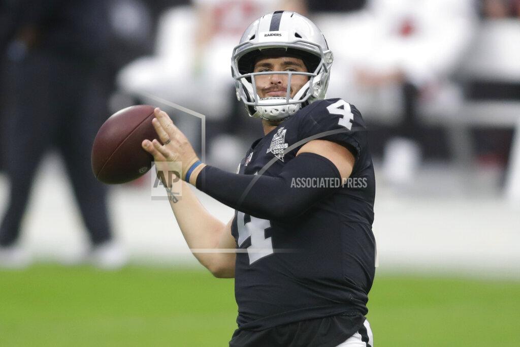 Isaac Brekken Las Vegas Raiders quarterback Derek Carr (4) warms up before an NFL football game against the Tampa Bay Buccaneers, Sunday, Oct. 25, 2020, in Las Vegas. (AP Photo/Isaac Brekken)