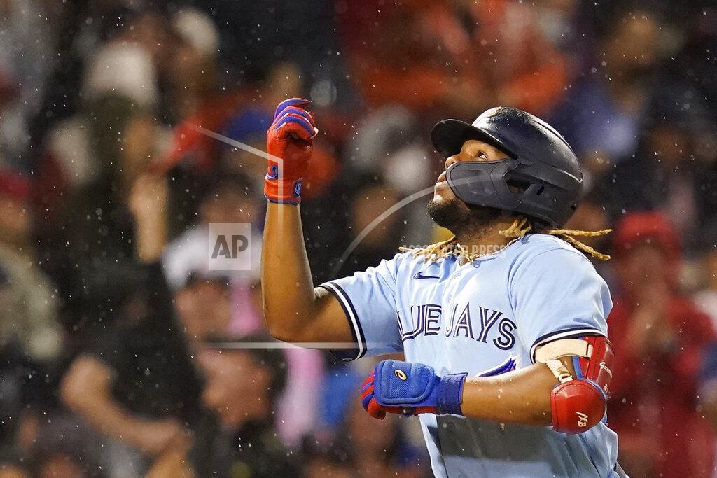 Elise Amendola Toronto Blue Jays' Vladimir Guerrero Jr. celebrates after hitting a three-run home run during the fifth inning of the team's baseball game against the Boston Red Sox at Fenway Park, Thursday, July 29, 2021, in Boston. (AP Photo/Elise Amendola)