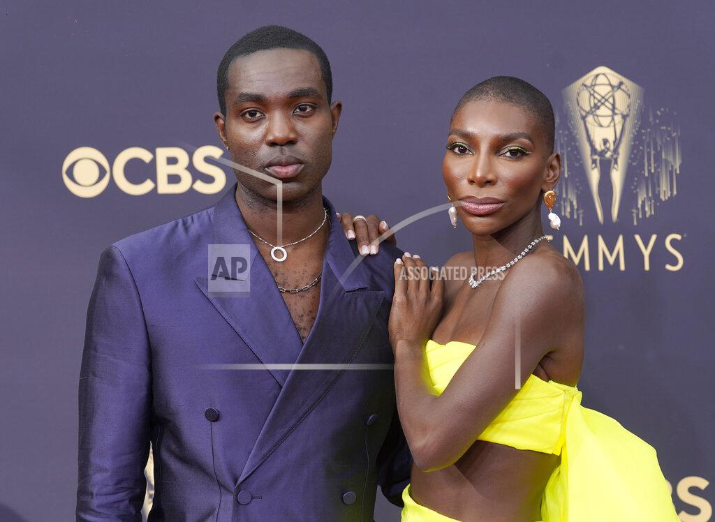 Chris Pizzello Paapa Essiedu, left, and Michaela Coel arrive at the 73rd Primetime Emmy Awards on Sunday, Sept. 19, 2021, at L.A. Live in Los Angeles. (AP Photo/Chris Pizzello)