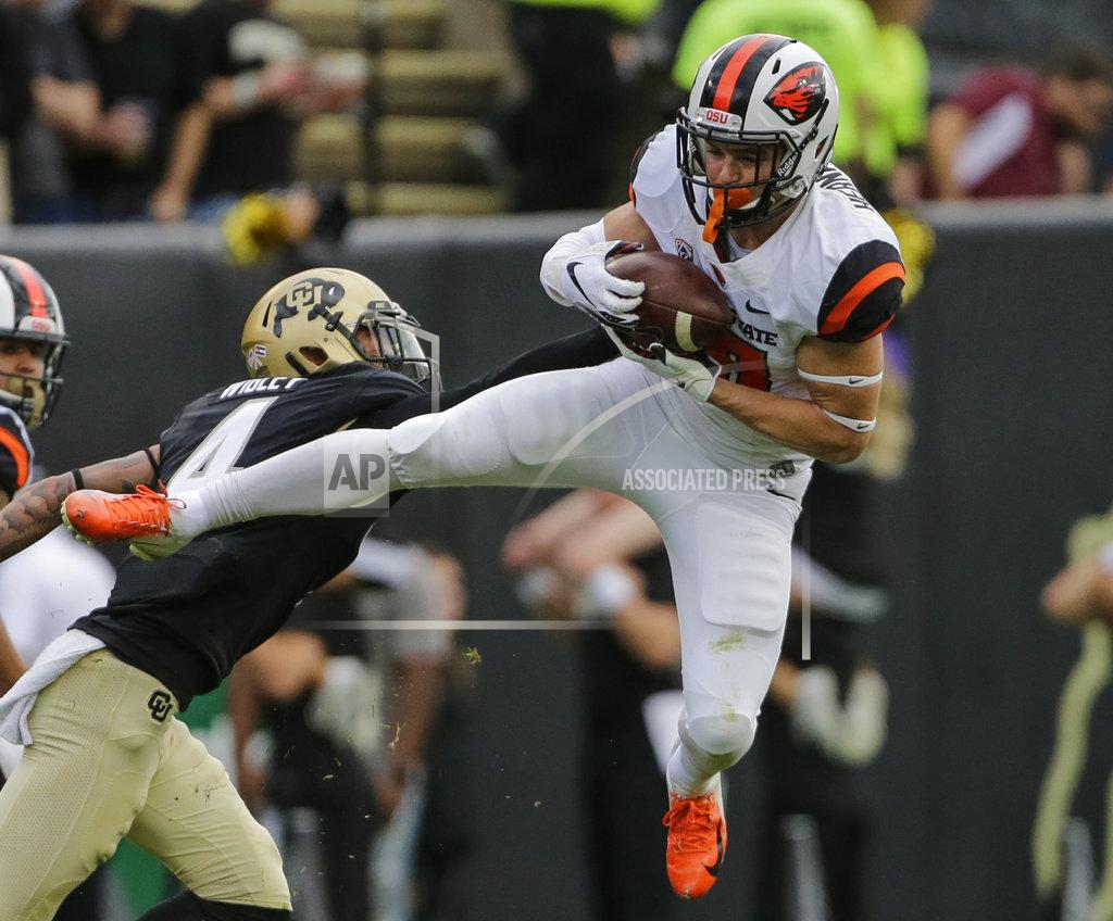 Jack Dempsey Oregon State wide receiver Timmy Hernandez (18) catches a pass as Colorado defensive back Dante Wigley (4) defends during the second half of an NCAA college football game, Saturday, Oct. 27, 2018, in Boulder, Colo. (AP Photo/Jack Dempsey)