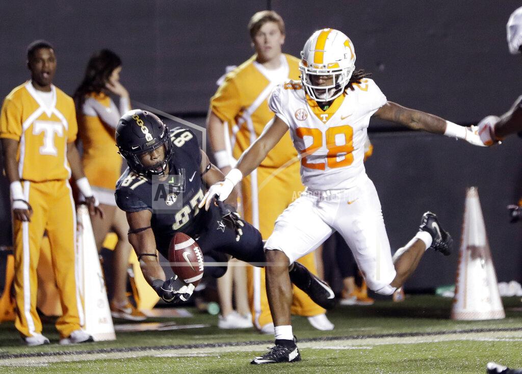 Mark Humphrey FILE - In this Saturday, Nov. 24, 2018 file photo, Vanderbilt wide receiver Amir Abdur-Rahman (87) catches a 26-yard touchdown pass as he is defended by Tennessee defensive back Baylen Buchanan (28) in the second half of an NCAA college football game in Nashville, Tenn. Tennessee defensive back Baylen Buchanan has a spinal condition that leaves his status for this season uncertain. Buchanan started all 12 games for Tennessee last year but hasn’t been participating in preseason practice. Tennessee coach Jeremy Pruitt says that Buchanan is being held out because “basically we’ve discovered that he has kind of a narrowing of the spine.” (AP Photo/Mark Humphrey, File)