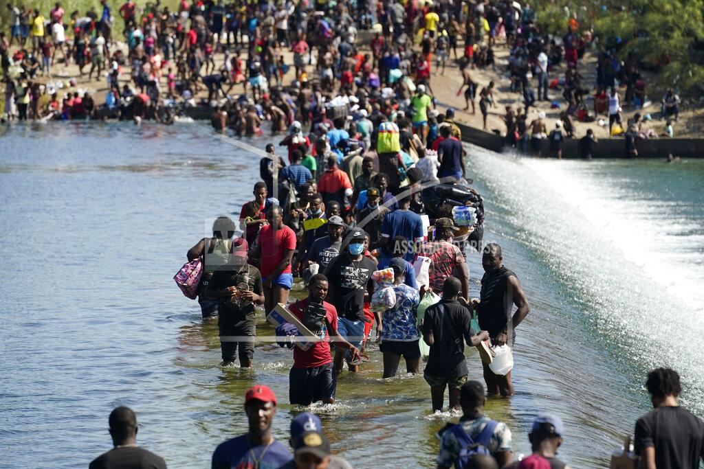 Eric Gay Haitian migrants use a dam to cross to and from the United States from Mexico, Friday, Sept. 17, 2021, in Del Rio, Texas. (AP Photo/Eric Gay)