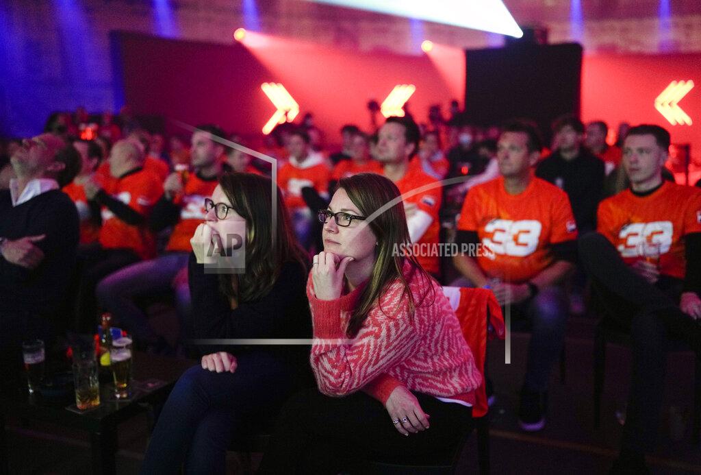 Peter Dejong Spectators watch Red Bull Racing driver Max Verstappen of the Netherlands in the Formula One Abu Dhabi Grand Prix in Abu Dhabi, United Arab Emirates on screens in a former prison in Breda, southern Netherlands, Sunday, Dec. 12, 2021. (AP Photo/Peter Dejong)